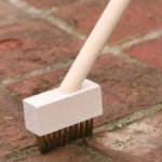 There are many makes of wire brush for cleaning paving joints. This one is made from wood